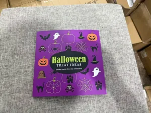 Halloween treat ideas recipe book detail view showing festive spooky snack designs cover.