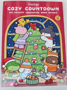 Detailopname van de Coco Wyo gezellige aftelling kerstkleurboek bundel omslag.