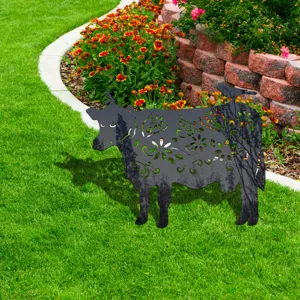 Metal cow silhouette yard art stake with hollow floral pattern for outdoor garden decor.