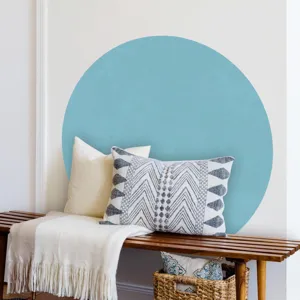 Detail view of a boho circular wall sticker in a cozy living room decor scene with wooden bench.