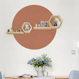Boho wall sticker detail showing the terracotta circle design styled with wooden shelves.