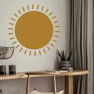Boho style mustard yellow sun wall sticker detail in cozy modern living room interior design.