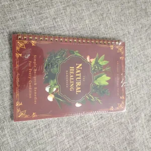 A5 spiral herbal handbook detail shot, showing the vintage botanical cover and wire binding.