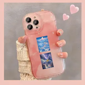 Close-up detail of the pink gradient phone case featuring ancient landscape sticker.