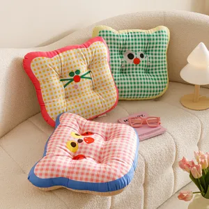 Cozy dopamine grid cat face chair cushion detail view, soft fabric throw pillow for home and student use.