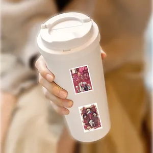 White travel mug with cute anime character stickers, cozy daily use tumbler for fans.