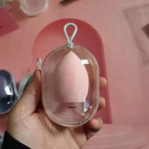 Portable capsule makeup sponge storage case with dustproof design and soft blending puff.