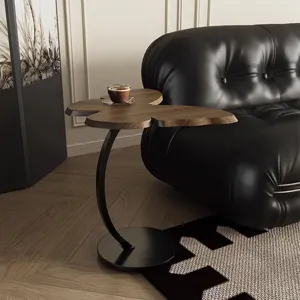 Modern butterfly side table with wooden top and curved metal base for living room.