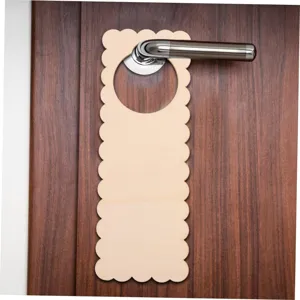 Detail shot of unfinished blank wooden door hanger with scalloped edges for DIY home decor.