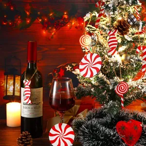 Wooden candy Christmas ornaments detail shot, red and white lollipops hanging on tree tree decor.