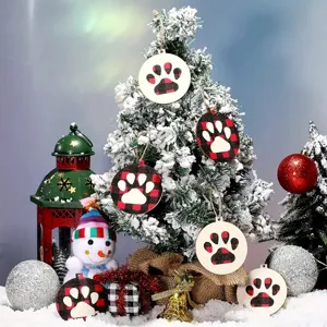 Detailed close-up view of Christmas wooden paw print hanging ornaments with red black plaid pattern.