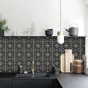 Close-up view of black and white geometric tile sticker for kitchen backsplash decoration.