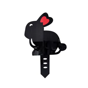 Black acrylic rabbit garden stake detail, mirrored finish with red heart ear accent decor.