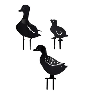Close-up view of black acrylic duck family garden stakes details, durable and weather-proof.