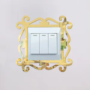 Detailed view of gold mirror acrylic switch wall sticker featuring decorative baroque lace frame.