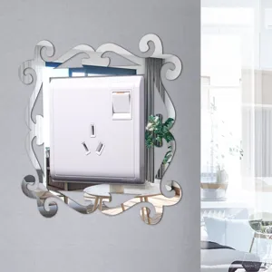 Decorative acrylic mirror switch sticker detail, elegant floral frame design for wall.
