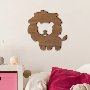 Wooden lion wall decor detail showcasing natural wood texture in a cozy child room setting.