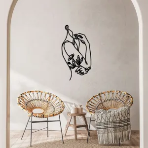 Minimalist abstract female body metal wall art detail scene hanging in modern living room.