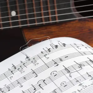 Transparent acrylic music bookmark detail, clear sheet music clip for piano practice.