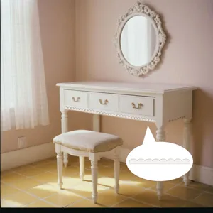 Close-up detail of wooden scalloped decorative trim molding for DIY home furniture design.
