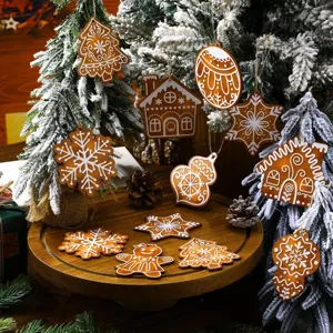 Detailed view of wooden Christmas tree hanging ornaments, gingerbread man and snowflake pendants.
