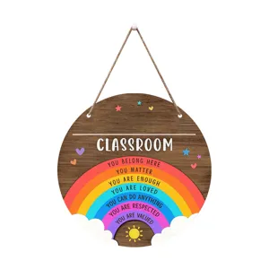 Detailed view of creative wooden classroom door sign with inspirational rainbow text and hanging rope.