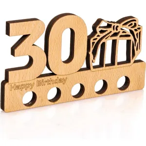 Detail shot of wooden 30th birthday money gift holder with carved birthday greetings.