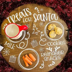 Wooden Santa treat tray detail showcasing festive white engraved text, cookie and milk plate design.