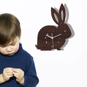 Wooden rabbit wall clock detail view showing cute animal design and clear dial numbers.
