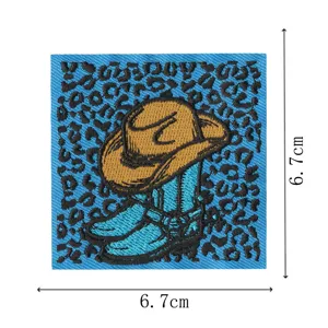 Embroidered cowboy boots patch with leopard print background, perfect for DIY clothing.