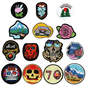 Embroidered patches assortment featuring skull, floral, and landscape designs for DIY jackets.