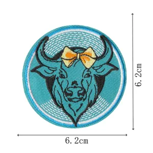 Cute blue bull embroidered patch with yellow bow, iron-on clothing accessory badge for DIY jeans.