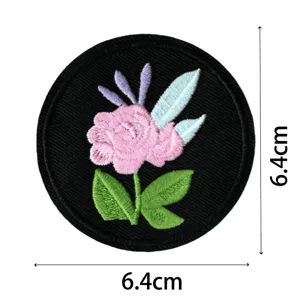 Round embroidered floral patch for clothing decoration, durable fabric badge measuring 6.4cm.