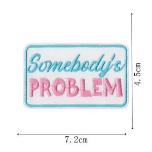 Toppa in tessuto ricamato con testo Somebody's Problem, design blu e rosa, misura 7,2x4,5cm.