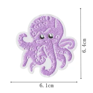 Detailed view of cute purple octopus embroidered patch showing precise size measurements.