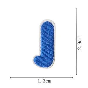 Blue letter J embroidery patch, mini DIY decorative clothing accessory, iron-on detail.