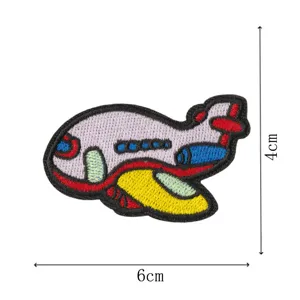 Cartoon airplane embroidery patch detail view, colorful fabric DIY accessory for clothes and bags.