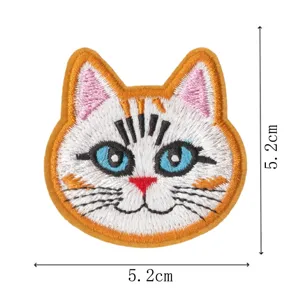 Closeup of embroidered cute cat patch with fine stitching and blue eyes, 5.2cm.