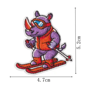 Embroidery patch features cute skiing rhino design, fine stitching, detail shot display.