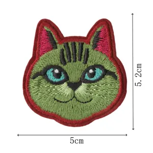 Close-up detail shot of the green cat embroidery patch showing fine stitching and size.