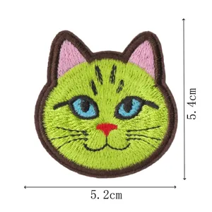 Close-up detail view of the cute green cat embroidered patch with dimensions for clothing repair.