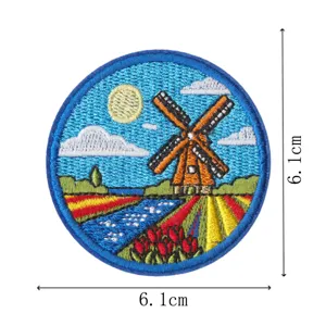 Round embroidered patch with Dutch windmill and tulip landscape, iron on badge 6.1cm