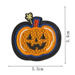 Halloween pumpkin embroidery patch detail, close-up view of festive spooky craft badge ornament.