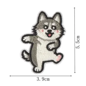 Close-up of cute husky embroidered patch, detailed stitching and grey dog design for DIY crafts.