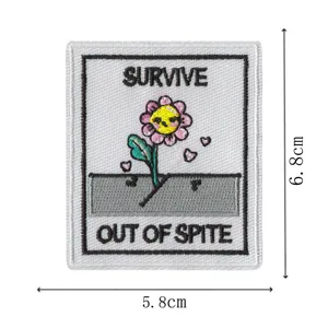 Detailed view of cute embroidered patch with funny survival flower design, premium fabric badge.