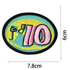 Détail de patch brodé, forme ovale avec motif de chiffre, accessoire de vêtement 7.8x6cm