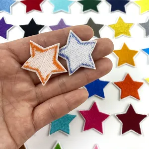 Close-up detail of colorful embroidered star patches showing fine stitching and vibrant colors.