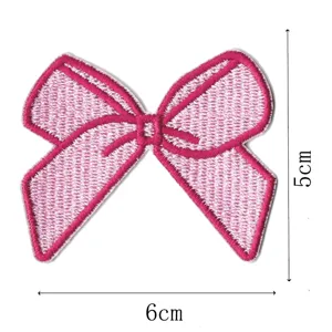 Pink embroidered bow patch detail, cute decorative fabric badge for clothing, bags and hats.