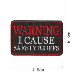 Embroidered patch with warning text, detailed craftsmanship, durable fabric badge for clothes.
