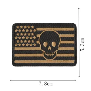 Tactical embroidered morale patch with American flag and skull design, hook and loop backing.